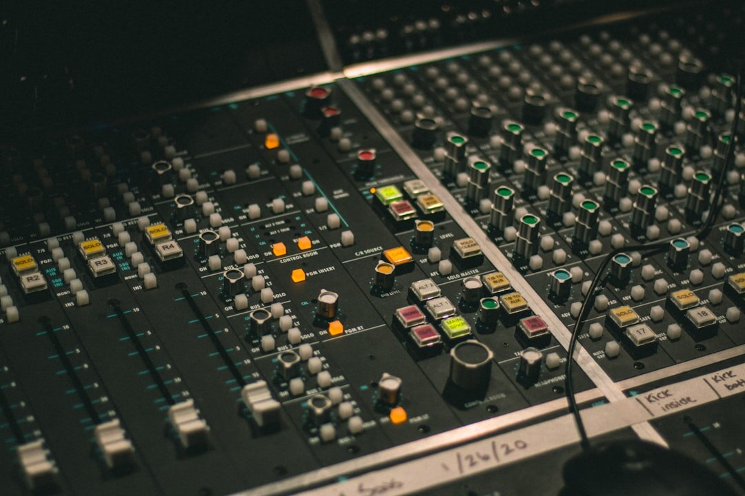 Modern recording studio with mixing console and monitors